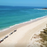Vans on beach drone